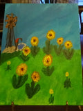 Wood windmill and sunflowers